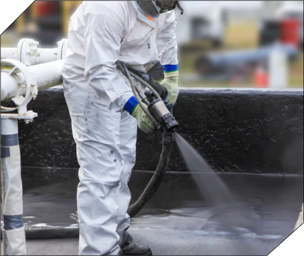 Technician spraying polyurea coating