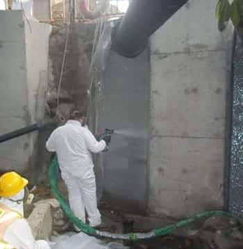 Spraying culvert to demonstrate techniques